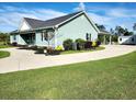A well-maintained home with a concrete driveway and lush landscaping at 926 Eula Dr., Conway, SC 29526