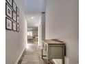 Bright hallway with a console table and framed photos on the wall at 1014 Tibetan St., Conway, SC 29526