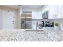 Beautiful kitchen features stainless steel appliances and granite countertops at 1100 Possum Trot Rd. # H234, North Myrtle Beach, SC 29582