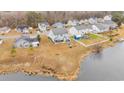 Aerial view of a home with a large yard that leads to waterfront access at 1213 Pineridge St., Conway, SC 29527