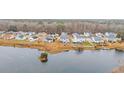 Community aerial view showcasing waterfront homes and lush greenery at 1213 Pineridge St., Conway, SC 29527