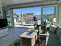 Beautiful sun room with tiled flooring, outdoor access, comfortable seating, and a lovely view of the water at 1310 Beautyberry Way, North Myrtle Beach, SC 29582