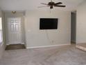 Living room with carpet, TV mount, and ceiling fan at 148 Junco Circle, Longs, SC 29568