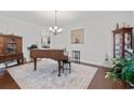 Formal dining room with grand piano and hardwood floors at 2024 Senator Gasque Rd., Marion, SC 29571