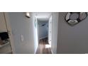 Narrow hallway with light wood floors and beach decor at 2504 N Ocean Blvd. # 1733, Myrtle Beach, SC 29577