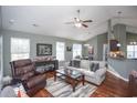 Open living room with hardwood floors, neutral walls, and ample natural light at 265 Encore Circle, Myrtle Beach, SC 29579