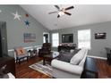 Spacious living room with hardwood floors, comfortable seating, and recessed lighting at 265 Encore Circle, Myrtle Beach, SC 29579