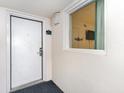 Condo entrance with door 1711 and window showing the interior, offering a glimpse of the living space at 2701 South Ocean Blvd. # 1711, North Myrtle Beach, SC 29582