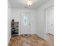 Bright entryway with tiled floor, door, and shoe rack at 3348 Merganser Dr., Conway, SC 29527