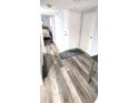 Inviting hallway showcasing modern vinyl flooring and leading to various rooms within the home at 351 Lake Arrowhead Rd. # 24-293, Myrtle Beach, SC 29572