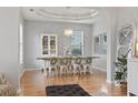 Farmhouse-style dining room with a wooden table and white chairs at 394 Blackberry Ln., Myrtle Beach, SC 29579