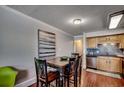 Kitchen and dining area with wooden table and chairs at 400 N Waccamaw Dr. # 304, Garden City Beach, SC 29576