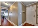 Light-colored hallway with wood floors, leading to other rooms at 400 N Waccamaw Dr. # 304, Garden City Beach, SC 29576