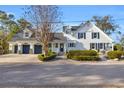 Stunning curb appeal with a three-car garage and meticulously maintained landscaping at 4600 Marion Circle, North Myrtle Beach, SC 29582