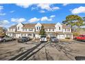 Front view of a light gray multi-unit building with parking at 500 Fairway Village Dr. # 1-O, Myrtle Beach, SC 29588