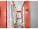 Bright coral hallway with wood-look floors and access to other rooms at 500 Fairway Village Dr. # 1-O, Myrtle Beach, SC 29588
