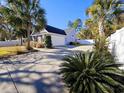 View of the house's attached garage and long driveway at 5126 Wesley Rd., Murrells Inlet, SC 29576