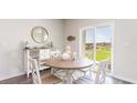 Dining area with round table and sliding glass doors at 536 Duvall St., Longs, SC 29568