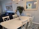 Dining room with white table, chairs, and a coastal-themed decor at 601 Hillside Ave. N # 1623, North Myrtle Beach, SC 29582