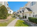 Townhome community with a walking path and manicured landscaping at 618 3Rd Ave. S # 4D, North Myrtle Beach, SC 29582