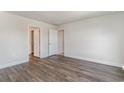 Spacious bedroom with neutral walls and grey wood-look flooring at 7015 Shooting Star Way, Myrtle Beach, SC 29579