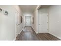 View of a bright hallway with neutral walls and flooring at 7350 Meadow Walk Loop, Loris, SC 29569