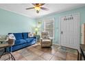 Bright living room with comfy seating and tiled floors at 107 Toby Ct. # 203-B, North Myrtle Beach, SC 29582