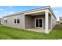 Covered back patio with access from sliding glass door at 1129 Black Lake Way, Conway, SC 29526