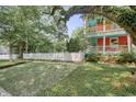 Two-story house with white picket fence and mature trees at 113 Meeting St., Georgetown, SC 29440