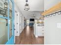 Inviting foyer with hardwood floors leading into the home's open-concept living area with a vaulted ceiling at 1141 Bethpage Dr., Myrtle Beach, SC 29579