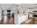 Modern kitchen featuring granite countertops, white cabinets, stainless steel appliances and open to living room at 1141 Bethpage Dr., Myrtle Beach, SC 29579