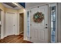 Bright entryway with decorative wreath and hardwood floors at 116 Emily Springs Dr., Conway, SC 29527