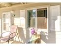 Inviting porch with a chair, potted flowers, and a view of the woods at 1280 White Tree Ln. # G, Myrtle Beach, SC 29588