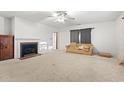 Bright living room featuring a fireplace and neutral carpeting at 316 N Highland Ave., Myrtle Beach, SC 29577