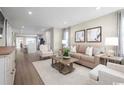 Bright and airy living room with hardwood floors and neutral decor at 321 Bent Green Ct. # 84A, Murrells Inlet, SC 29576