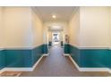 Building interior hallway with teal and white walls at 4384 Daphne Ln. # H, Murrells Inlet, SC 29576