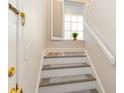 Interior staircase with white risers and gray carpet at 4384 Daphne Ln. # H, Murrells Inlet, SC 29576