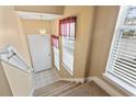 Staircase with carpeted steps and neutral-colored walls at 4432 Montrose Ln. # H, Myrtle Beach, SC 29579