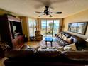 Living room boasts ocean view and comfortable seating at 4505 S Ocean Blvd. S # 1-E, North Myrtle Beach, SC 29582