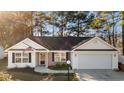 Attractive single-Gathering home with a brick-accented entrance and attached two car garage at 5933 Rahnavard Blvd., Myrtle Beach, SC 29588