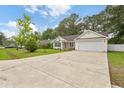 Inviting home with a spacious driveway and an attached two-car garage at 5933 Rahnavard Blvd., Myrtle Beach, SC 29588