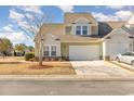 Two-story townhome with attached garage and manicured lawn at 6172 Catalina Dr. # 911, North Myrtle Beach, SC 29582