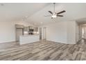 Open concept kitchen with gray cabinets, granite counters, and stainless steel appliances at 640 Woodside Dr., Conway, SC 29526