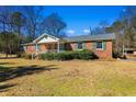 Brick ranch house with a covered porch and a large yard at 7152 Highway 134, Conway, SC 29527