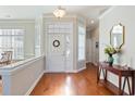 Bright entryway with hardwood floors and a half wall at 858 Edgewater Dr., Murrells Inlet, SC 29576