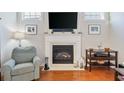 Living room fireplace with a white mantel at 858 Edgewater Dr., Murrells Inlet, SC 29576