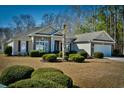 Charming, single-story home with brick accents, attached garage and a well-manicured front yard and mature landscaping at 905 Adaline Ct., Myrtle Beach, SC 29579