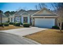 Charming, single-story home with brick accents, attached garage and a well-manicured front yard and mature landscaping at 905 Adaline Ct., Myrtle Beach, SC 29579