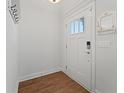 Bright and airy entryway with wood-look flooring and built-in coat hooks at 1113 Mary Read Dr., North Myrtle Beach, SC 29582