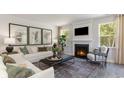 Living room with a cozy fireplace and large windows offering natural light at 114 Ranch Haven Dr., Murrells Inlet, SC 29576